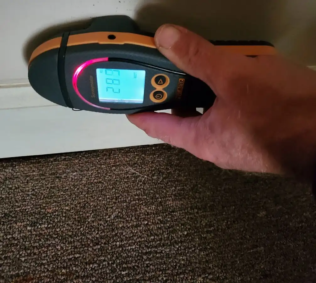 Moisture detection at baseboard during Storm Damage Restoration in Vergennes